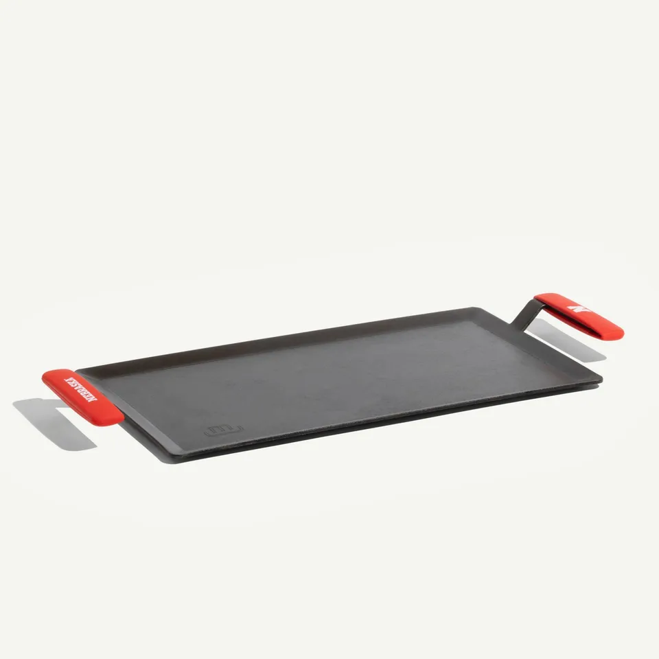 made-in-carbon-steel-griddle-with-university-of-nebraska-cornhuskers-silicone-ha image 1