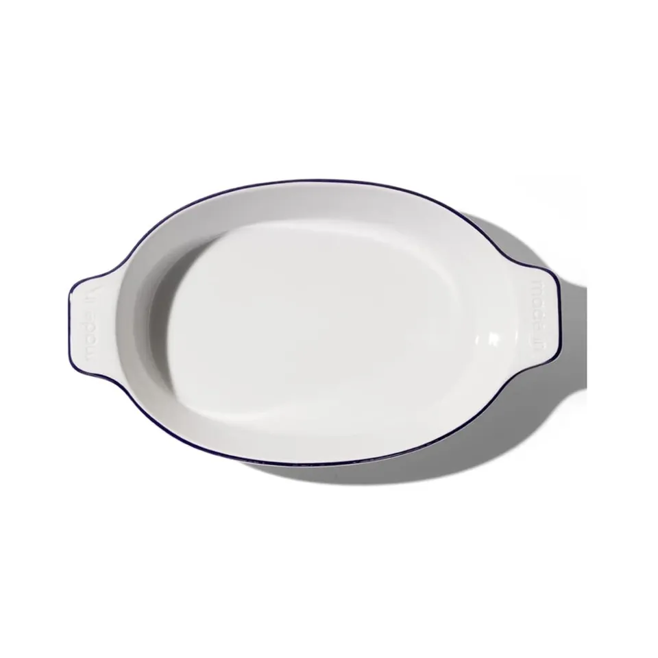 made-in-oval-baking-dish-navy-rim-handcrafted-french-porcelain-bakeware-10-bakin image 1