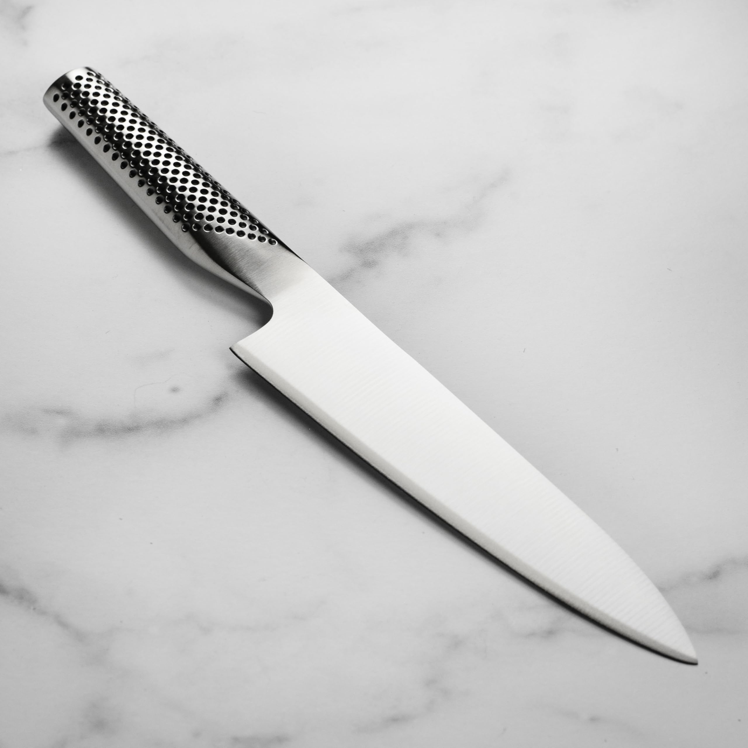 global-7-chef-s-knife-cromova-18-japanese-stainless-steel-dimpled-handle image 5