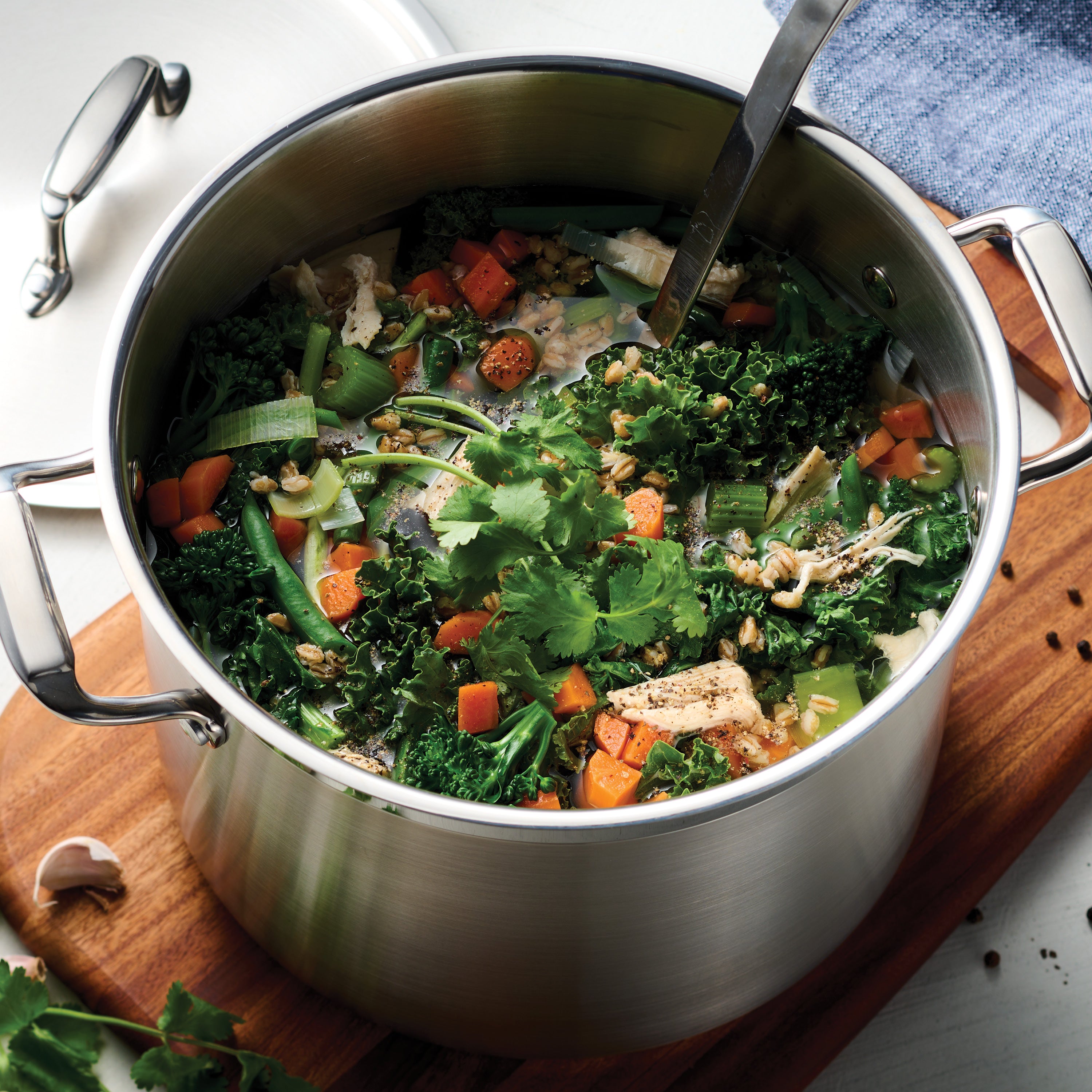 tramontina-gourmet-stainless-steel-covered-stock-pot-with-tri-ply-induction-base image 2
