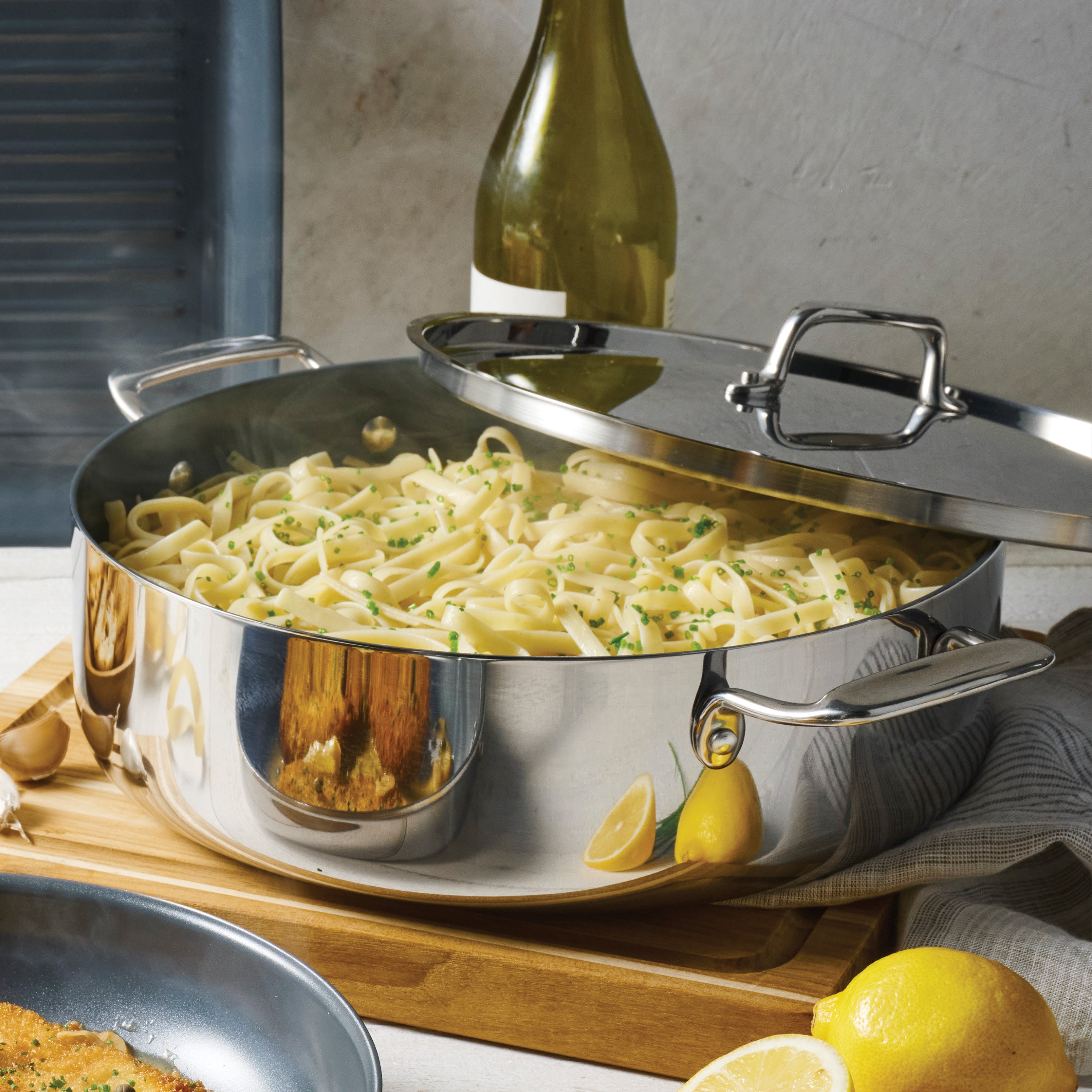 tramontina-6-5-quart-covered-stainless-steel-casserole-with-12-inch-dosa-tawa-ta image 6