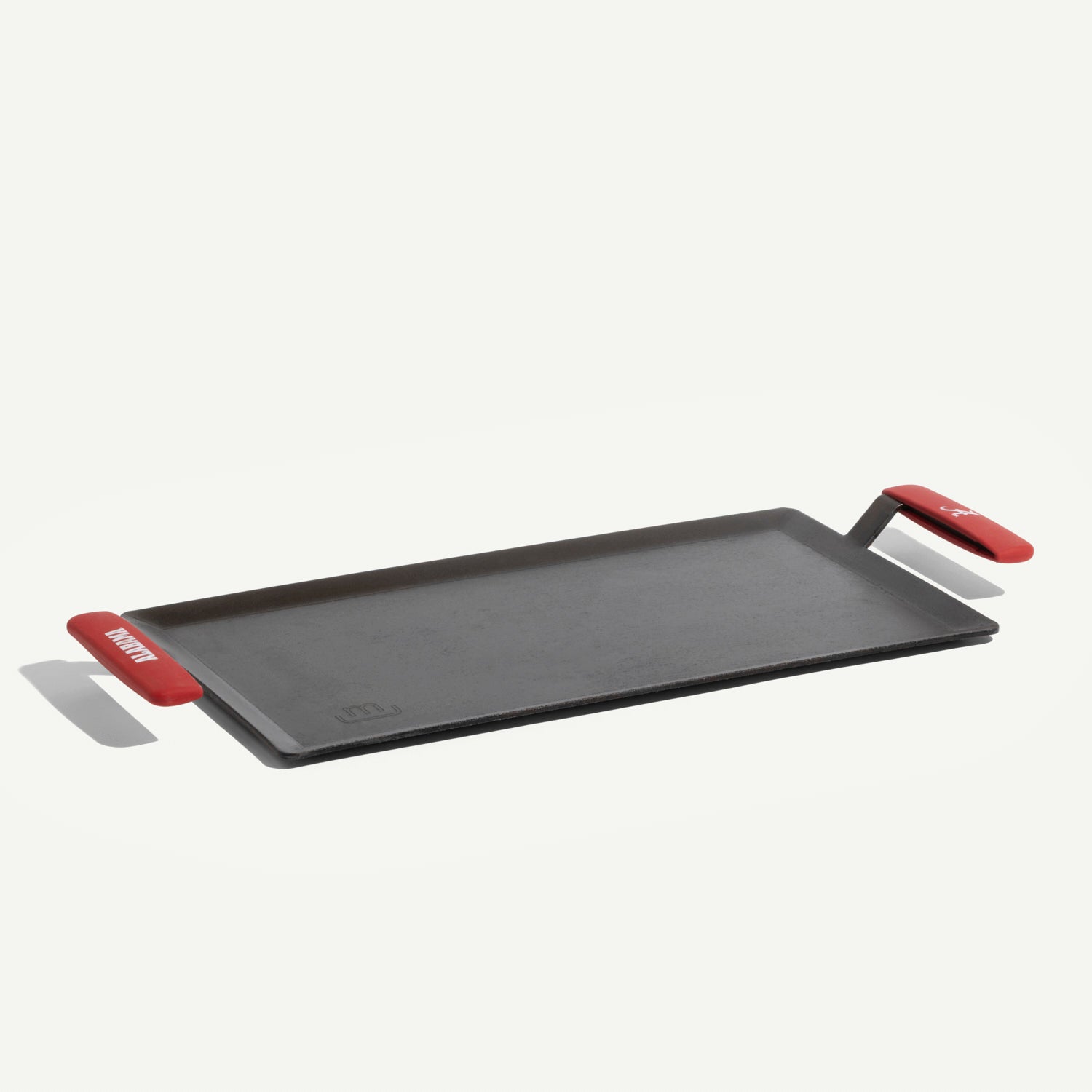 made-in-carbon-steel-griddle-with-university-of-alabama-crimson-tide-silicone-ha image 1