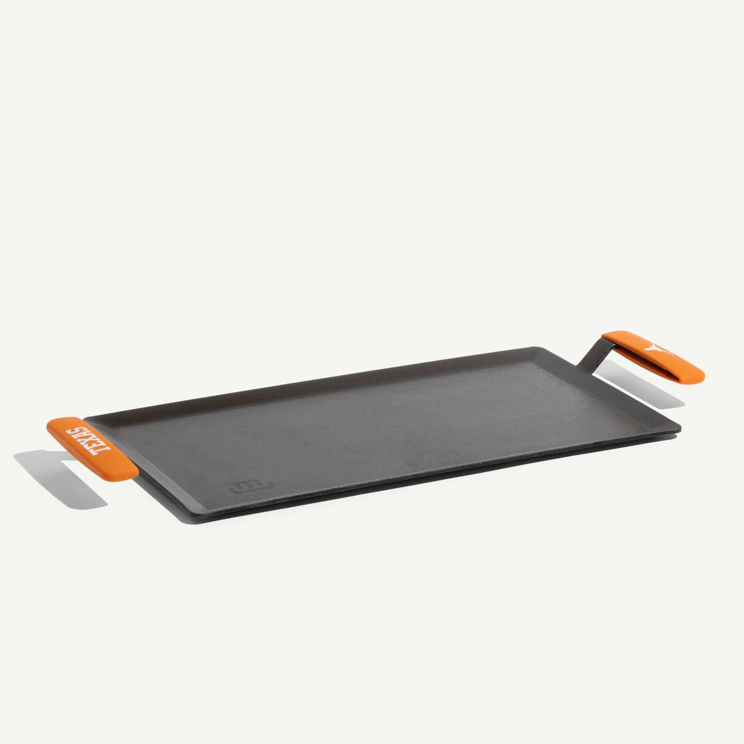 made-in-carbon-steel-griddle-with-university-of-texas-longhorns-silicone-handle- image 1