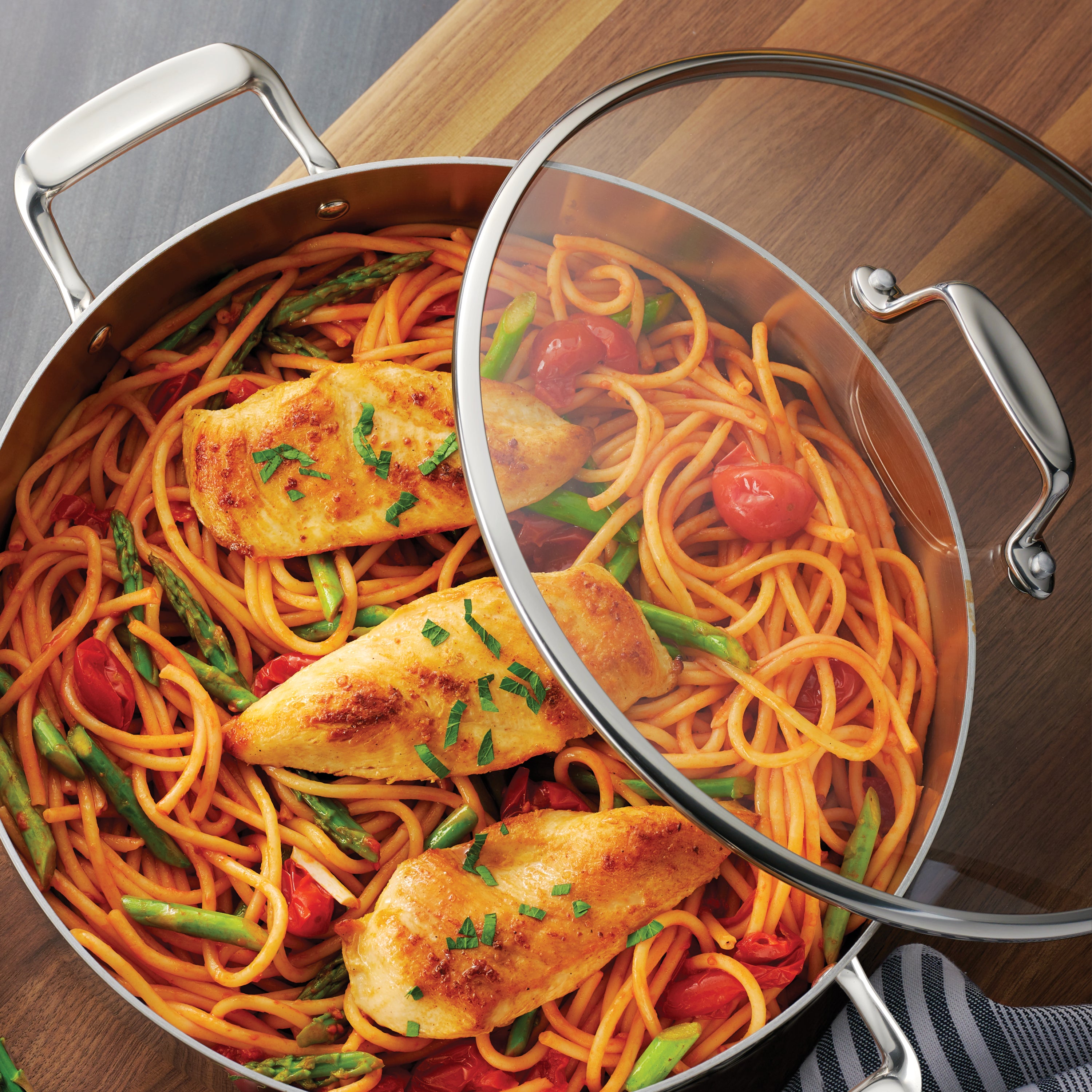 tramontina-gourmet-tri-ply-clad-6-quart-stainless-steel-covered-braiser-with-tem image 2